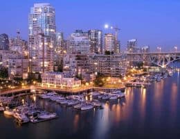 Nighttime Vancouver city and water scene.